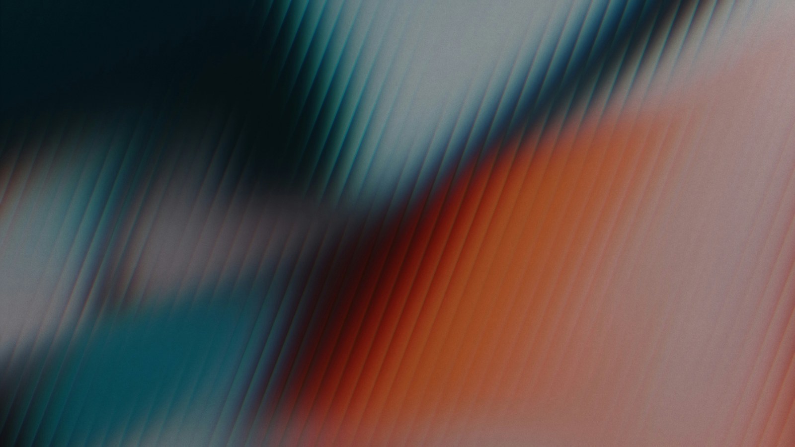 Abstract fluted glass texture, diagonal ridges shading from deep teal into orange